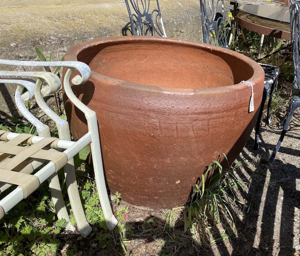 A large circular terracotta planter, diameter 85cm, height 62cm